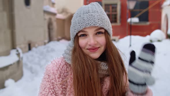 Closeup of Cheerful Positive Young Woman Smiling To Camera While Walking Outdoors in Winter City alt