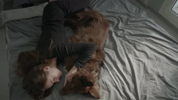 Woman On Bed With Her Dog alt