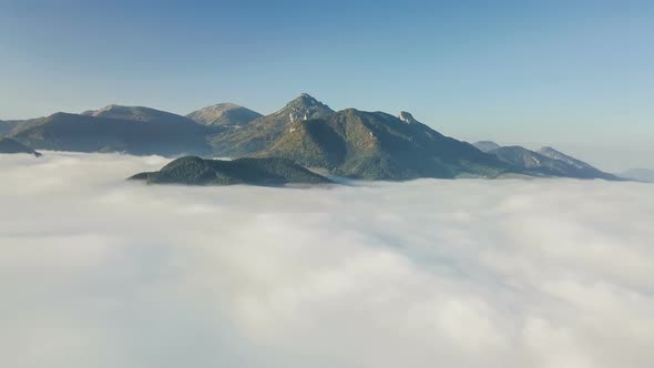 Aerial Mountains above Clouds alt