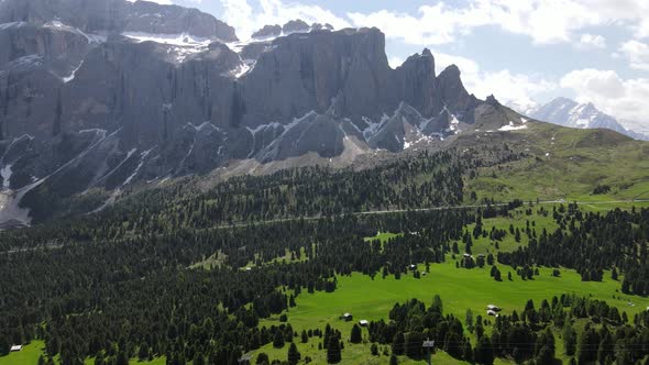 Aerial flight above stunning Alps in Italy. High mountain peaks sharp cliffs in Dolomites alt