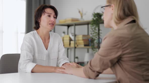 Depressed Woman Talking with Friend