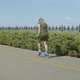 Woman Roller Riding Backwards Crossover in Park - VideoHive Item for Sale