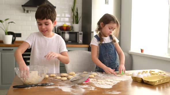 Cute Sister and Brother Spends Leisure at Home Baking Cookies Enjoying Weekend Activity