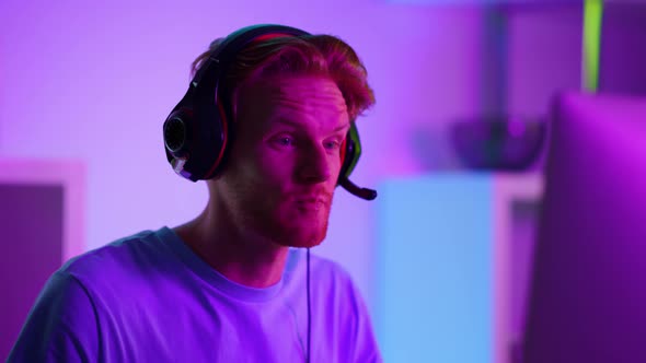 Smiling Gamer Enjoying Cyber Match Victory Closeup alt