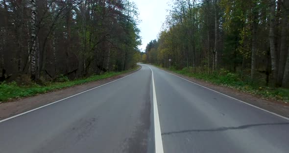 Low Shot From Drone Over Empty Road with Climb Up