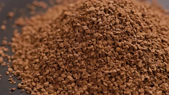 Heap of Freezedried Instant Coffee Granules Slow Spinning Loopable Closeup View