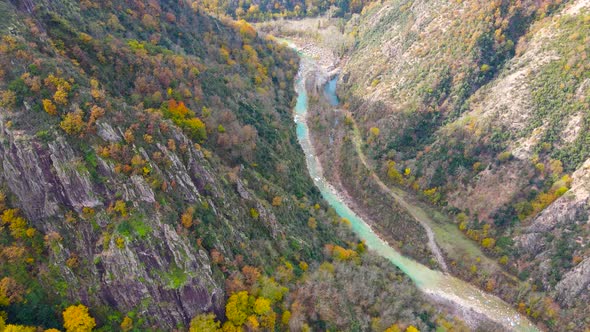 steep green mountains, deep forest and mountain road, beautiful valley and river alt