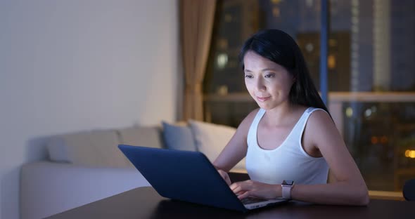 Woman Type on Laptop Computer at Home