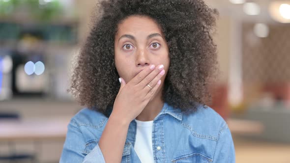 African Woman Reacting To Loss  alt