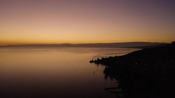 Flying along the shore of Lake Léman above Cully, Lavaux - SwitzerlandBeautiful sunset colors alt