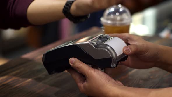 Customer using smart watch to payment with credit transaction