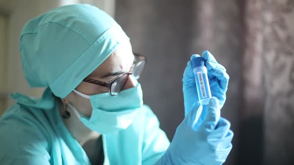 Conceptual dolly video of a doctor holding a recipient with the coronavirus COVID-19 vaccine.