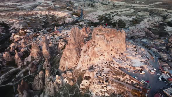 Top Drone Footage of Uchisar Cave Town Surrounded By Valley with Limestone Cone Rocks alt
