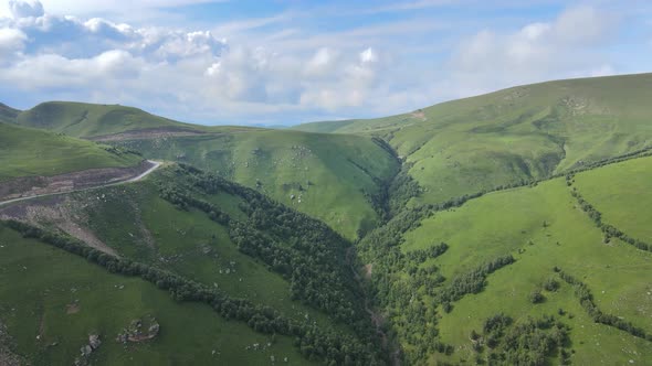 View of the Green Caucasus Mountains in Summer From the Sky alt