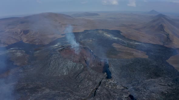 Aerial View Above Fagradalsfjall Volcanic Fissure Eruption Cone Fumes Tilt Down Reveal Inside of alt