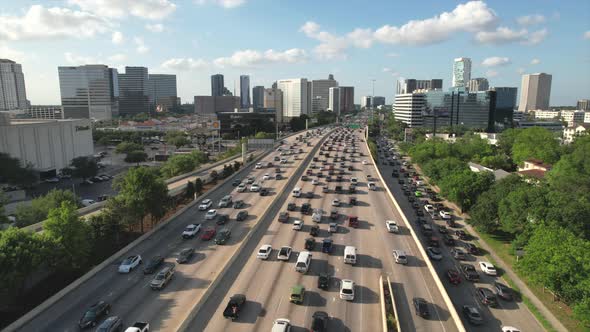 Horizontal flight over a busy highway in the Galleria area. Captivating composition. Good for transi alt