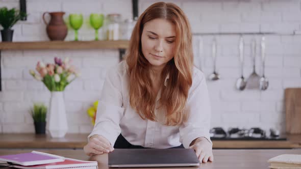 Businesswoman Watching Educational Lecture at Home alt