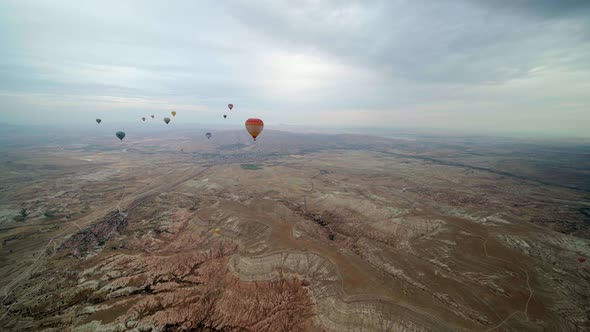 Hotair Balloons Flying Over the Mountain Landsape