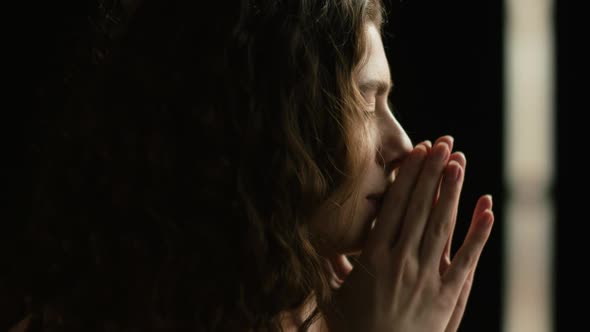 Girl Does Yoga Exercise, Looks Out the Window and Camera alt