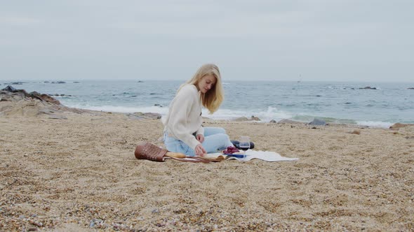 Woman BookLover Is Reading On Beach