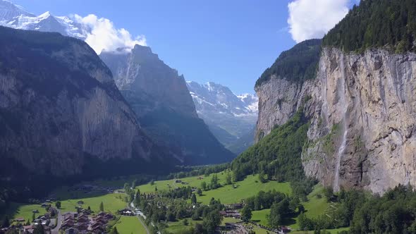 Aerial travel drone view of the Lauterbrunnen Valley and Staubbach Falls, Switzerland. alt