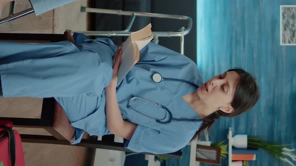 Vertical Video Nurse Giving Assistance to Retired Woman in Nursing Home alt