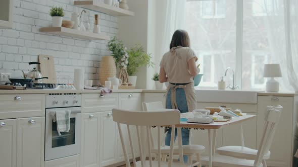 Woman Preparing Dough in the Kitchen