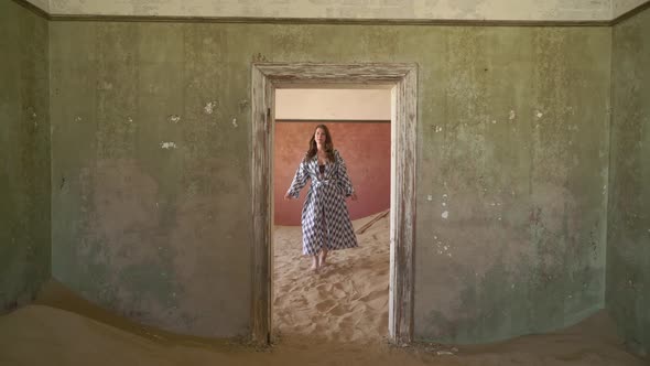 Young Woman in Dress and Underwear in Abandoned Building Posing in Room