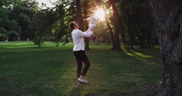 At Sunset Dad with His Small Boy Playing in the alt