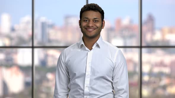 Portrait of Smiling Businessman with Crossed Arms alt