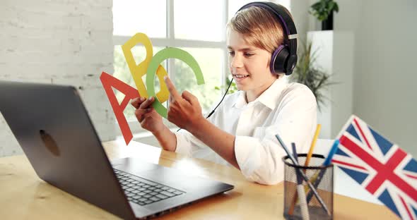 Boy Studying Letters Online Laptop