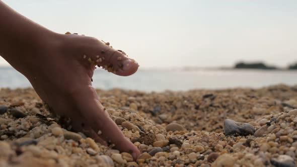 Woman`s Hand Digging and Keeping Sand on a Shore in Turkey at Sunset in Slo-mo