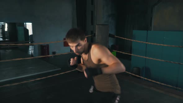 Lightweight Boxer Punch The Camera On The Ring In Vintage Gym alt