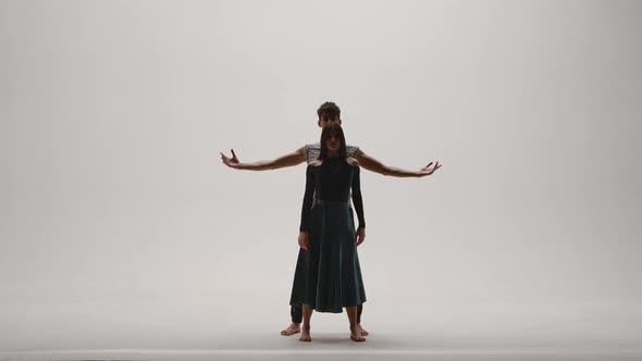 Elements of Modern Choreography Contemporary Performed By a Young Couple of Dancers on a White alt