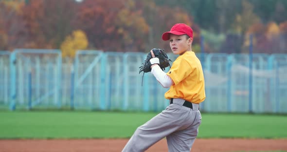 Baseball at School, the Pitcher Pitches Fastball Toward Batter, Young Boy Throwing the Ball, Slow alt