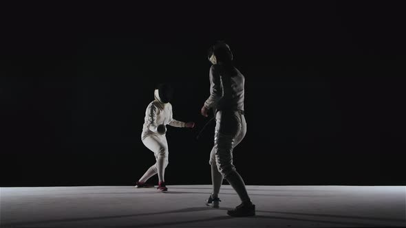 Back View Silhouettes of Two Duel Fencers in White Suits, Mastery in Foil Fencing, Sports Lifestyle alt