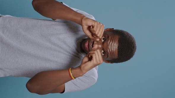 Vertical Video Aggressive Man Clenching Fists and Showing Raised Knuckles alt