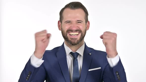 Ambitious Businessman Celebrating Success, White Background alt