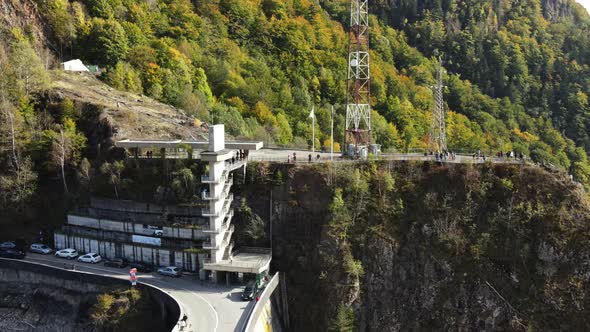 Aerial drone view of nature in Romania. Valley in Carpathian mountains with viewpoint full of people alt