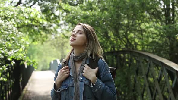 woman with backpack in a mixed forest Beskidy in Poland alt