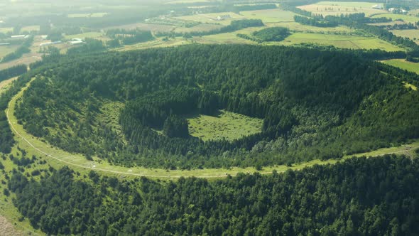 Drone shooting a huge crater that has become a forest. Abu Oreum, Jeju Island.