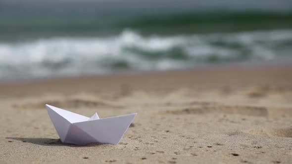 White Paper Boat On The Beach
