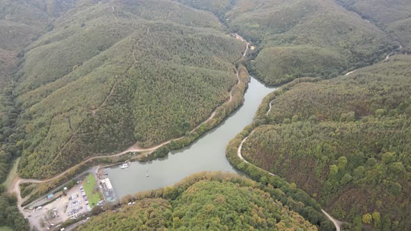 aerial lake view between forests and hills