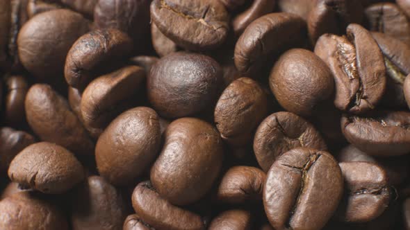The Macro of Coffee Beans Rotates at the Bottom is the Background of Roasting Coffee Beans alt