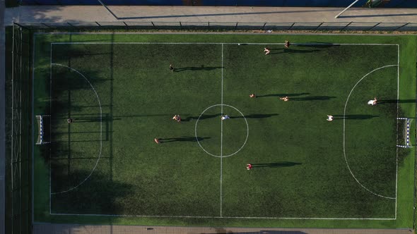Top view of a Sports soccer field with people playing soccer