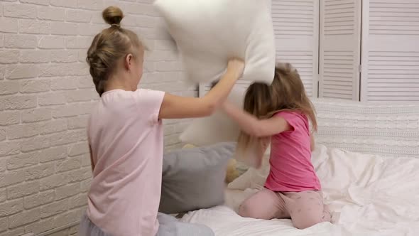 Two Cute Children Girls Playing in the Bedroom