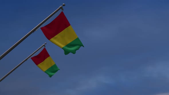 Guinea Flags In The Blue Sky - 4K
