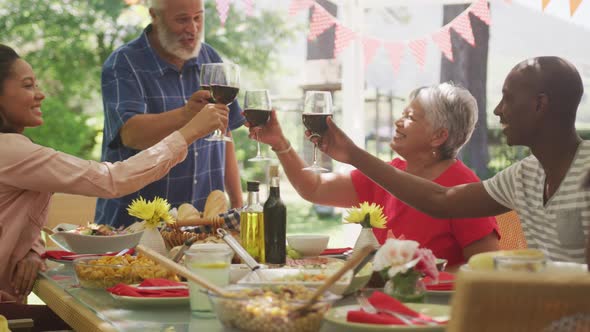 Multi-generation African American family spending time in garden alt