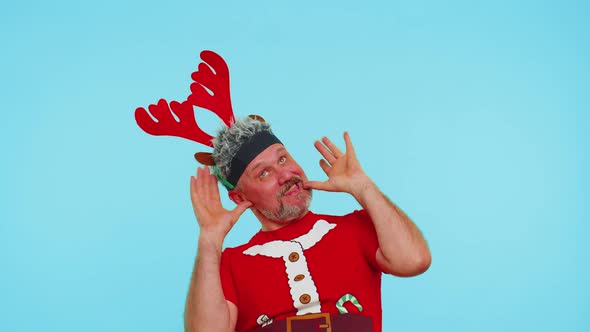 Man in Christmas Tshirt Listening Music Via Earphones Dancing Disco Fooling Around Having Fun alt