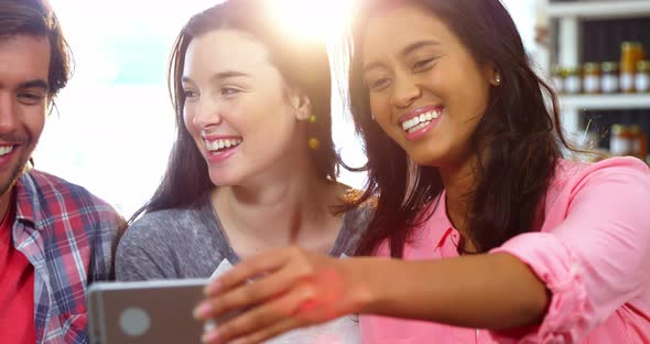 Group of friends taking a selfie alt